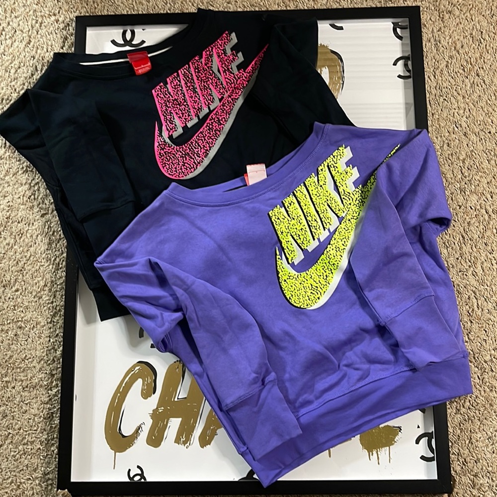 2 Nike sweat shirts.